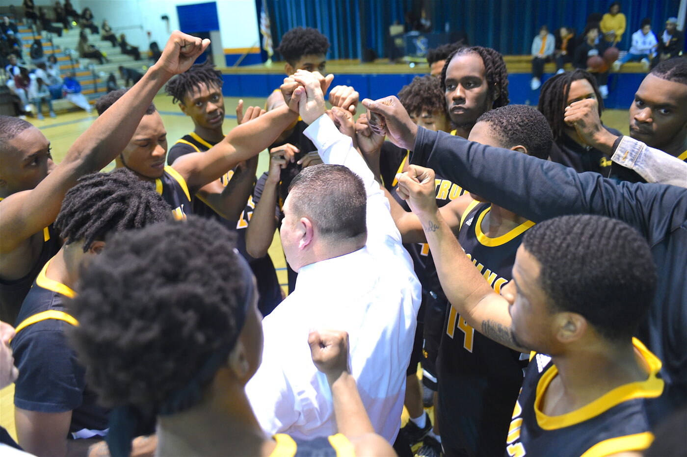 Men's basketball team huddle