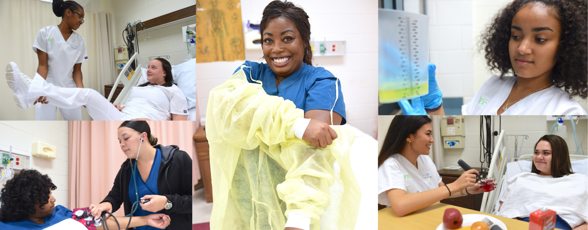 Three nursing students in blue scrubs studying together at a table with books and notes in a classroom or lab setting.