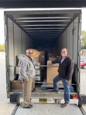 03 Eric Smith And David Summers Stand By The Loaded Truck At Ftcc